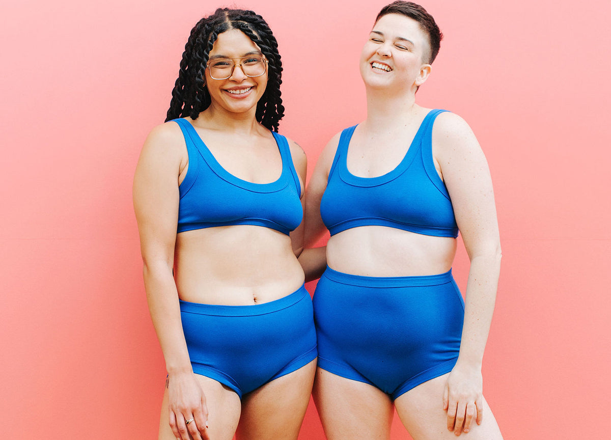 Two models wearing sets of Thunderpants underwear and Bralettes in Blueberry Blue.