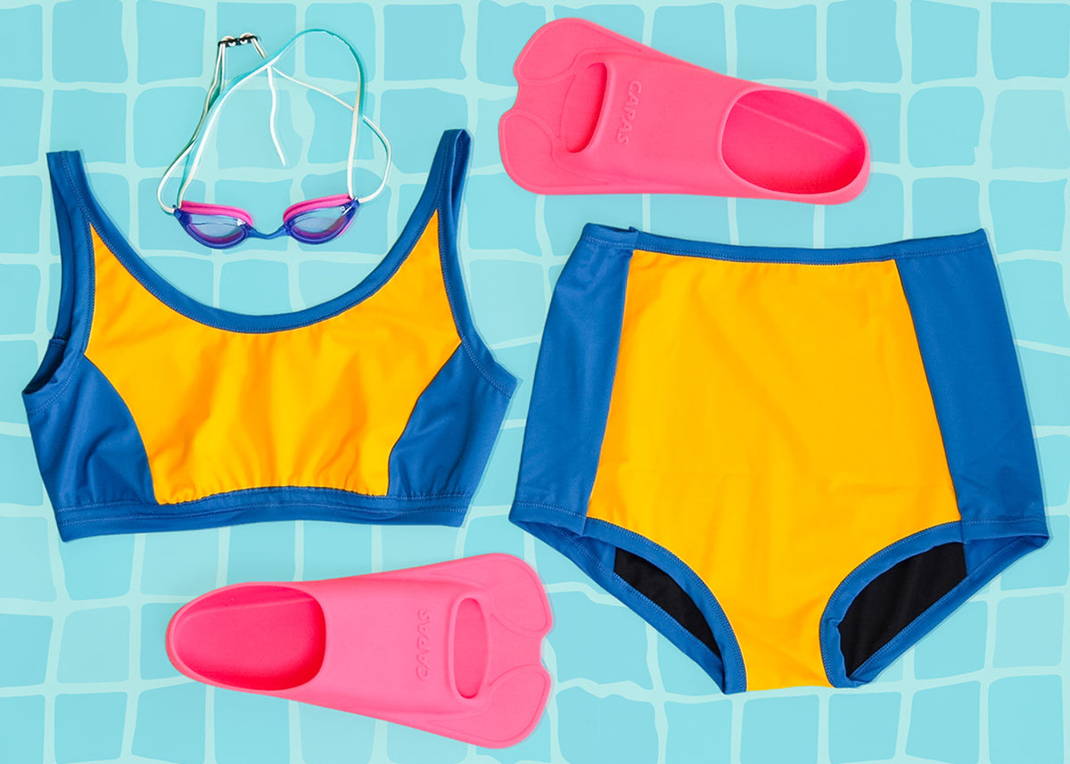 Flat lay of Thunderpants US yellow and blue paneled Swimwear Set.