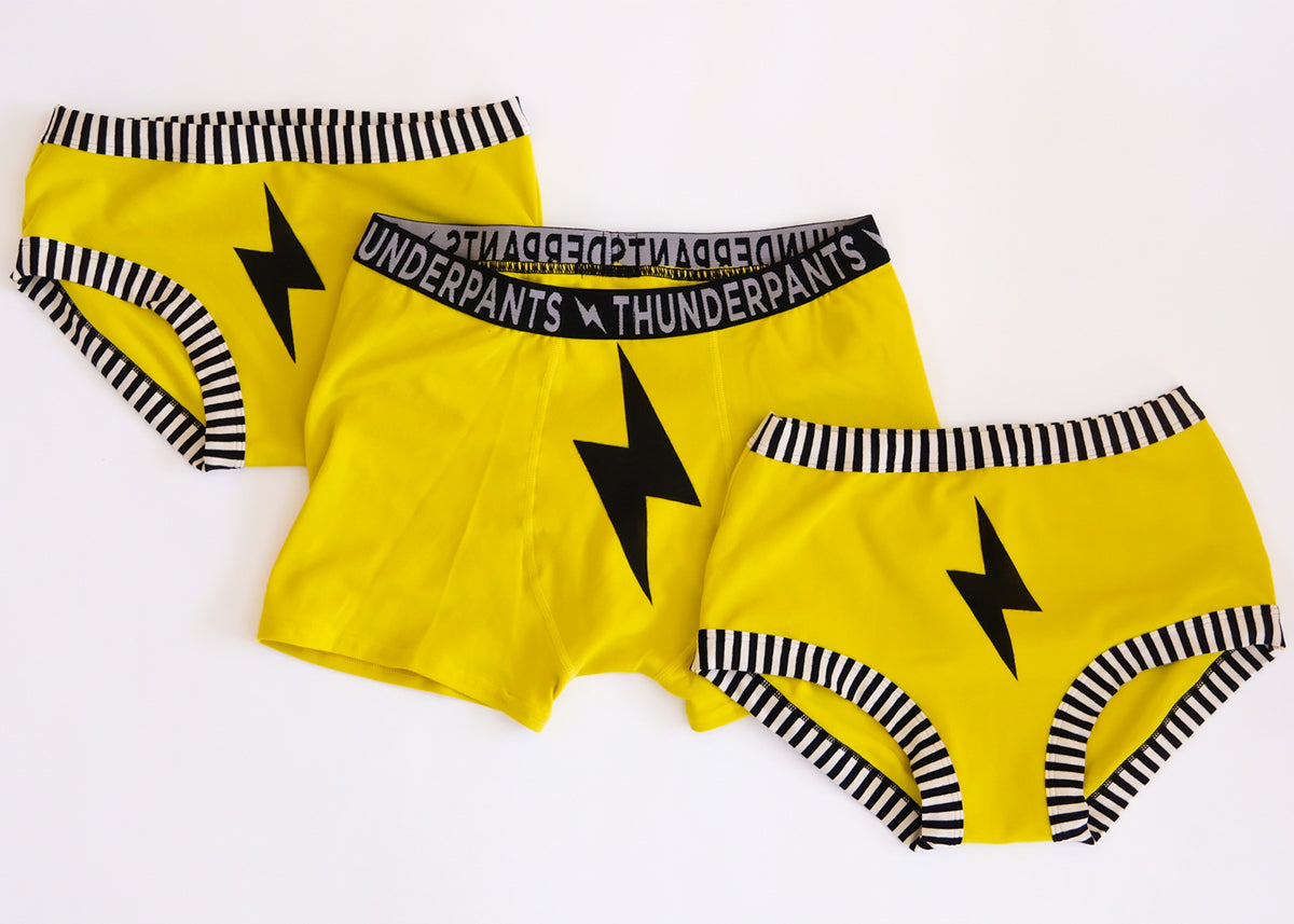 Three pairs of Thunderpants underwear in various styles - yellow with black lightning bolt.