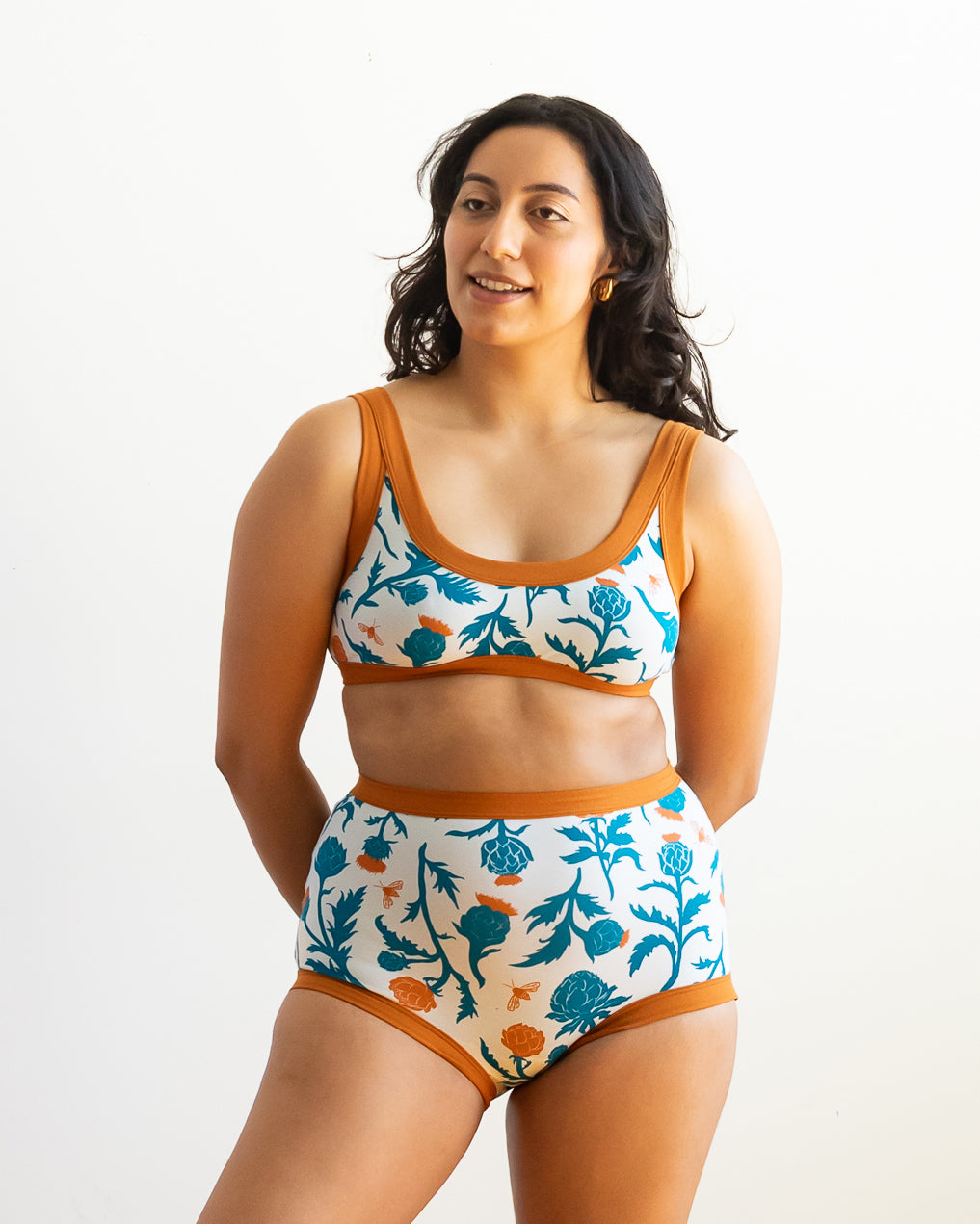 Model wearing Thunderpants Bralette and Sky Rise style underwear in Robben's Artichokes print - teal and rust artichokes and bees.