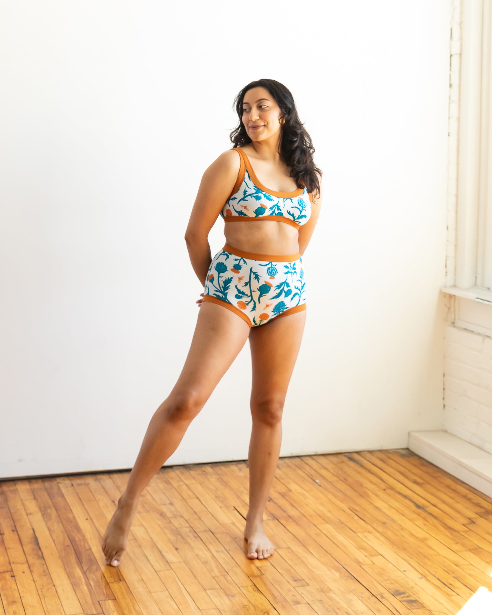 Model wearing Thunderpants Sky Rise style underwear and Bralette in Robben's Artichokes print - teal and rust artichokes and bees.
