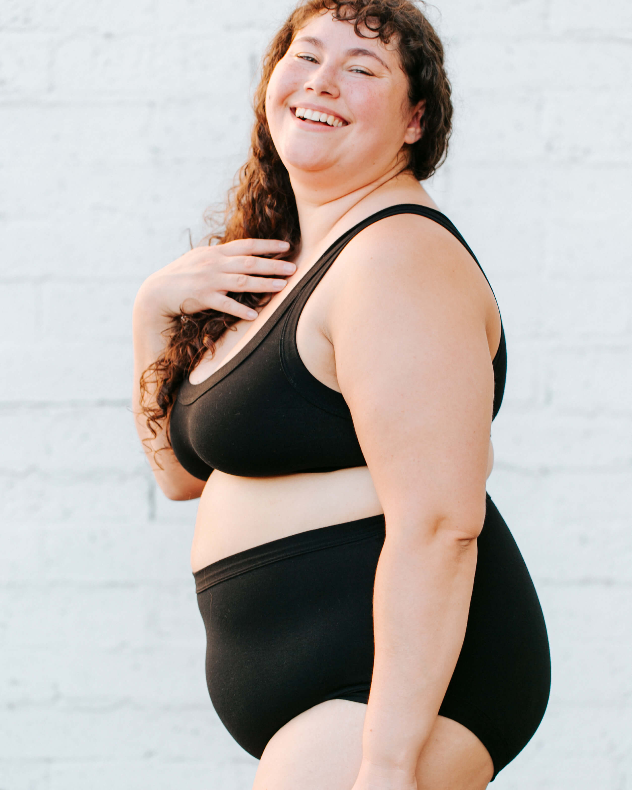 Close up of model wearing Thunderpants Original style underwear and Bralette in Plain Black.