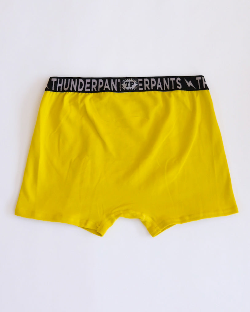 Flat lay of Thunderpants Boxer Brief style underwear in Thunderstruck - yellow with a black lightning bolt.