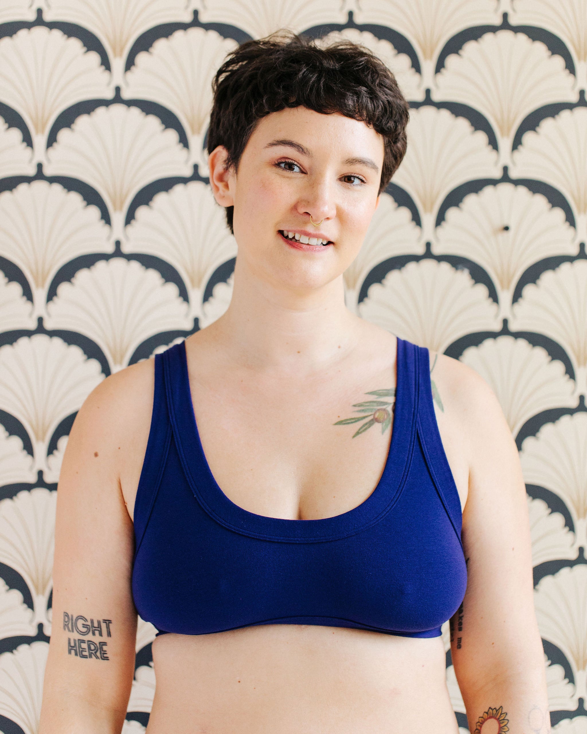 Model wearing Thunderpants Bralette in Indigo blue.