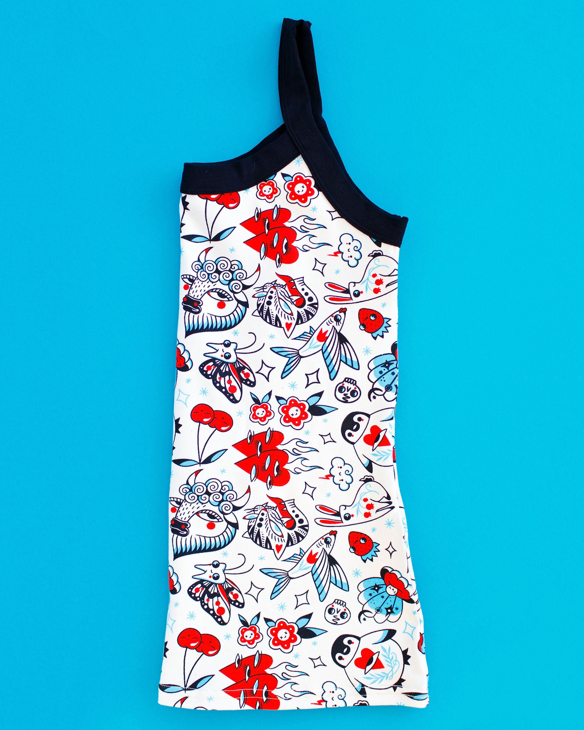 Flat lay of folded Thunderpants Cami in Inked Up print - black, blue, and red tattoos.