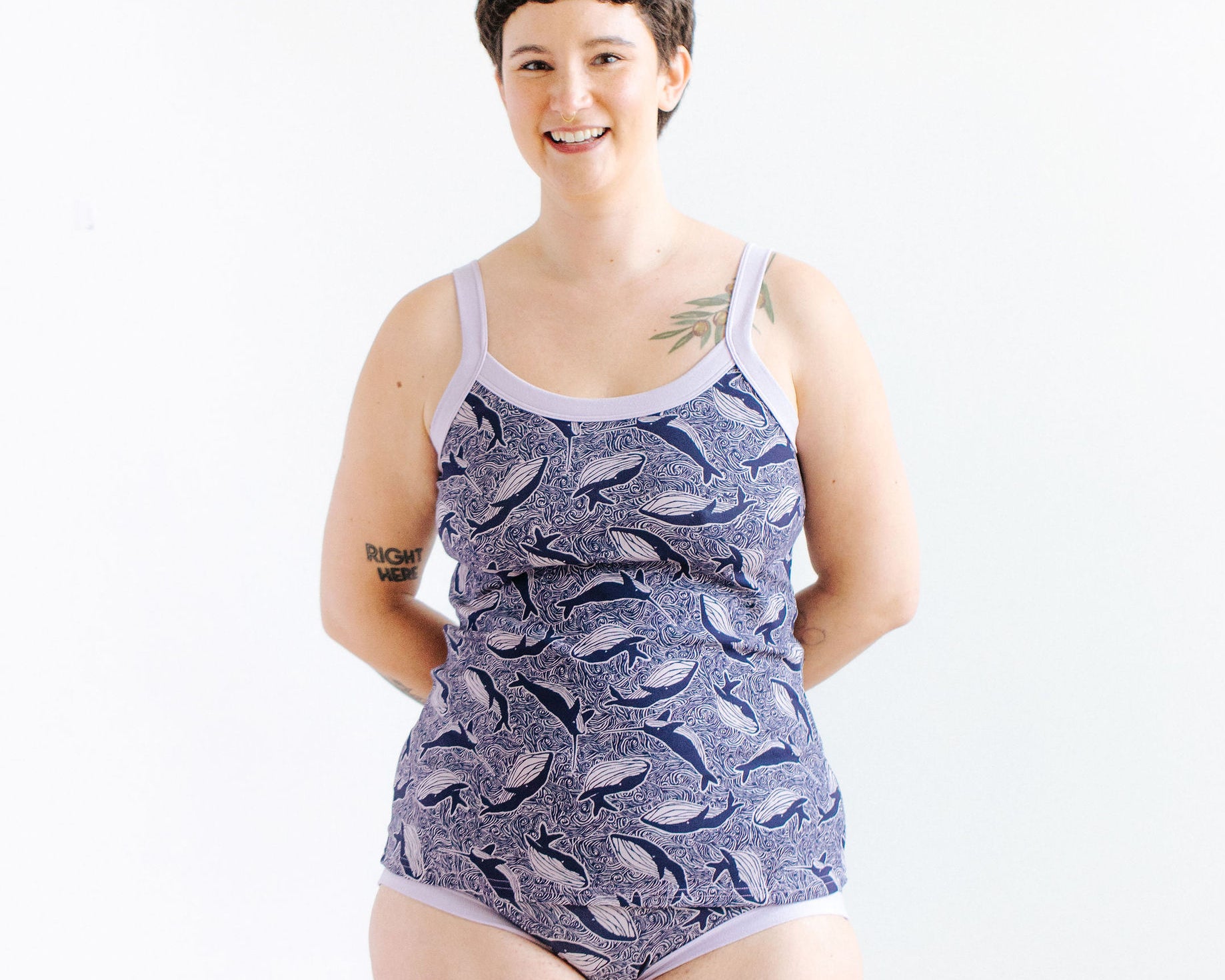 Model wearing Thunderpants Cami and Hipster style underwear in Whale, Whale, Whale print - indigo whales on lavender.
