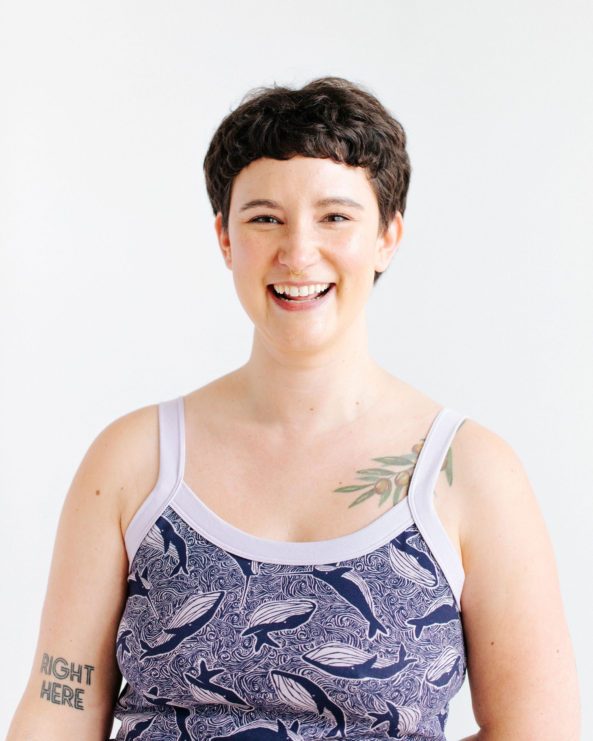 Model wearing Thunderpants Cami in Whale, Whale, Whale print - indigo whales on lavender.