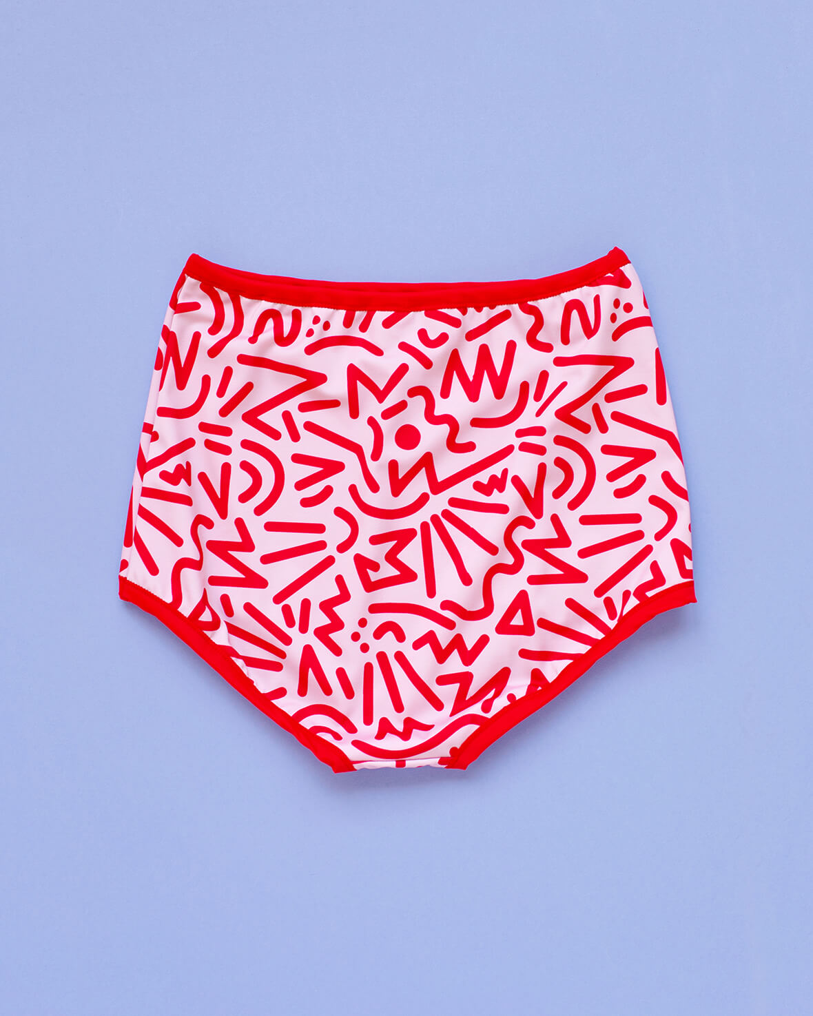 Flat lay of Thunderpants Sky Rise style Swim Bottoms in Energy Vibe print: light pink with dark pink designs.