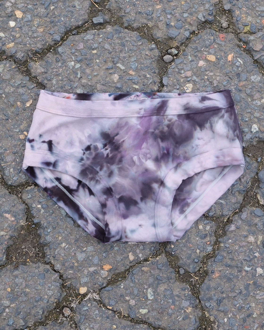 Flat lay of Thunderpants Hipster style underwear in Haunted Haze Ice Dye - purply grey dye pattern.
