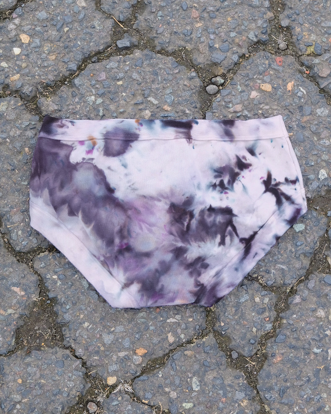 Flat lay of Thunderpants Hipster style underwear in Haunted Haze Ice Dye - purply grey dye pattern.