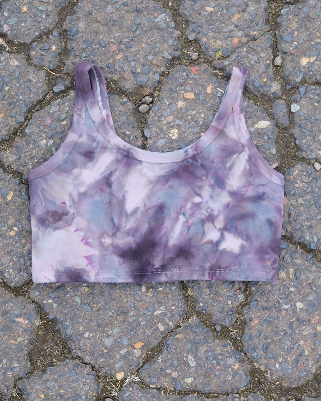 Flat lay of Thunderpants Longline Bra in Haunted Haze Ice Dye - purply grey dye pattern.