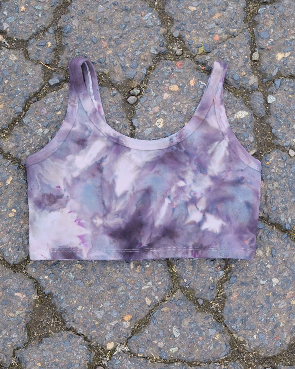 Flat lay of Thunderpants Longline Bra in Haunted Haze Ice Dye - purply grey dye pattern.