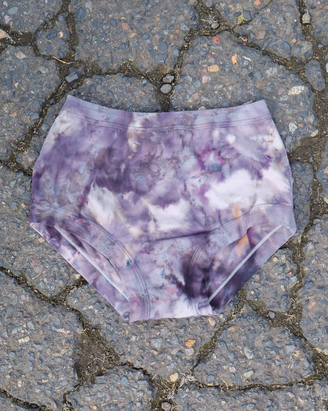 Flat lay of Thunderpants Original style underwear in Haunted Haze Ice Dye - purply grey dye pattern.