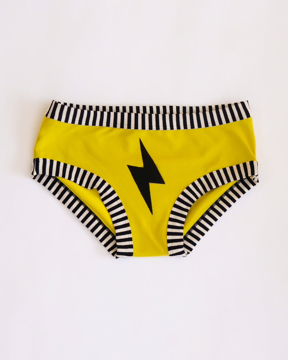 Flat lay of Thunderpants Hipster style underwear in Thunderstruck - yellow with a black lightning bolt.
