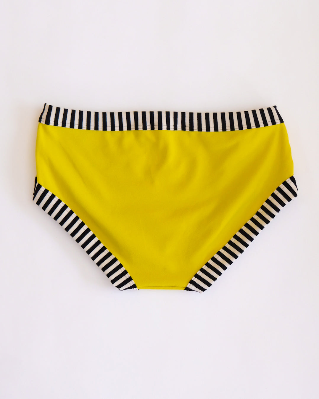 Flat lay of Thunderpants Hipster style underwear in Thunderstruck - yellow with a black lightning bolt.