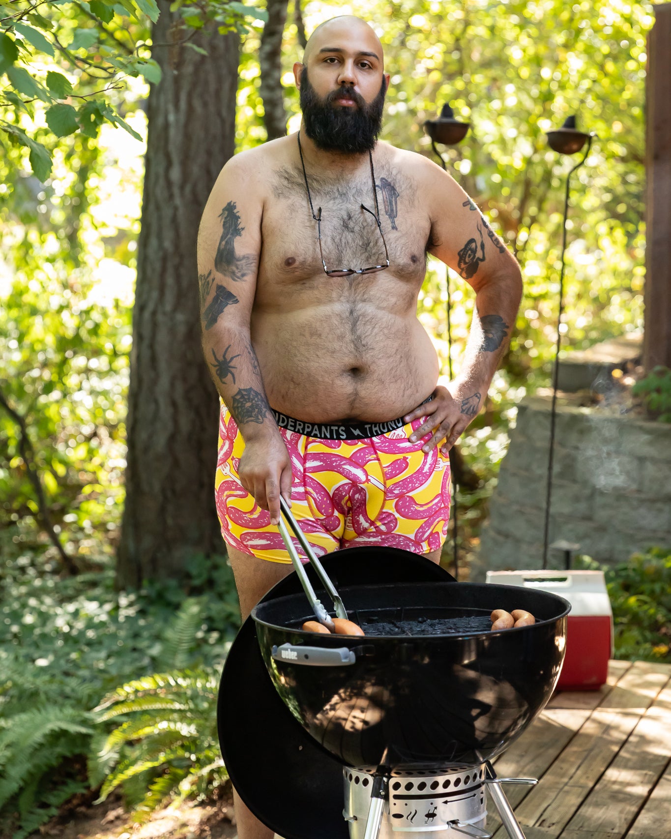 Models wearing Thunderpants Boxer Brief style underwear in Hot Dawg! print - pink sausages on yellow background and red binding.