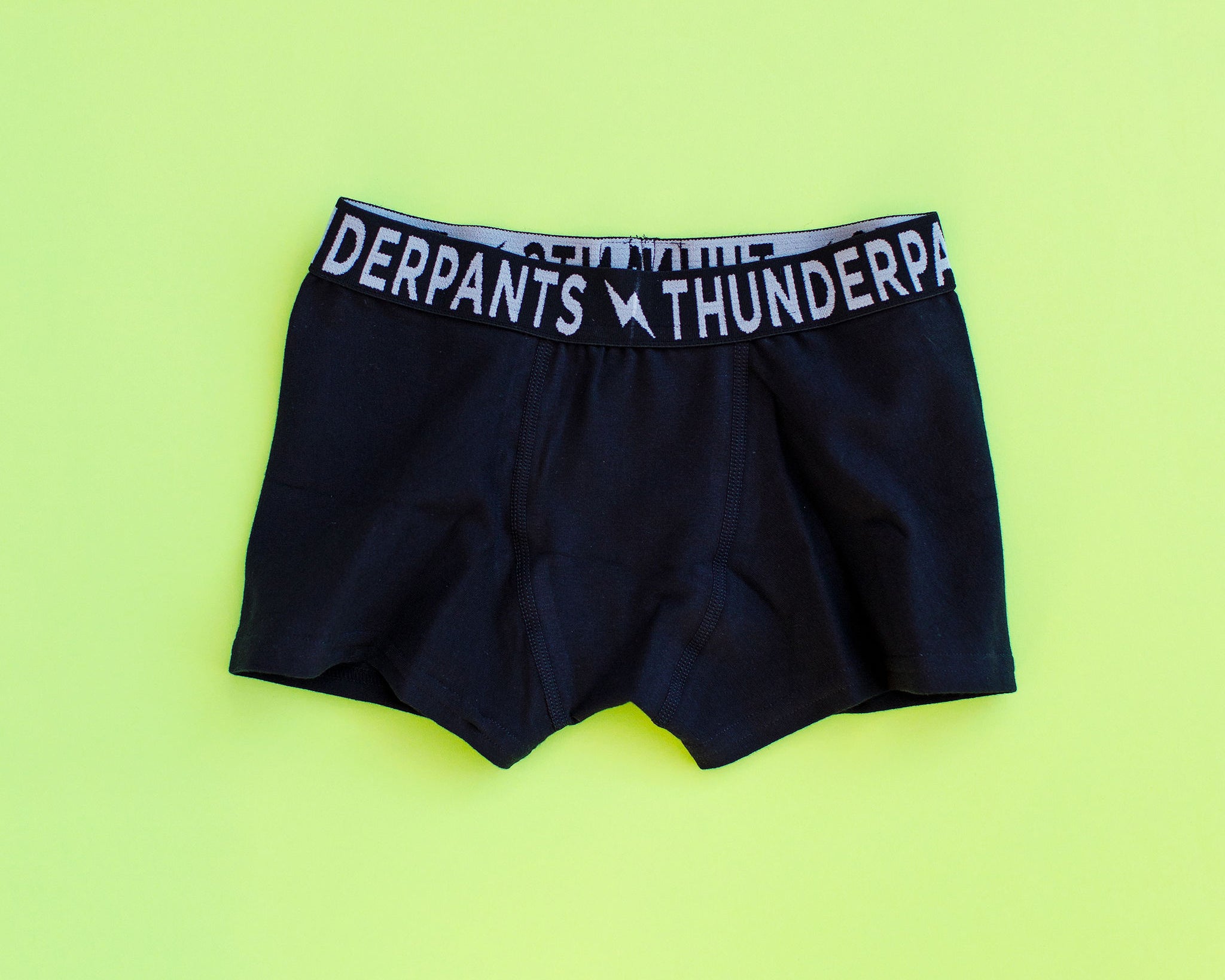 Flat lay of Thunderpants Kids Boxer Brief style underwear in Plain Black.