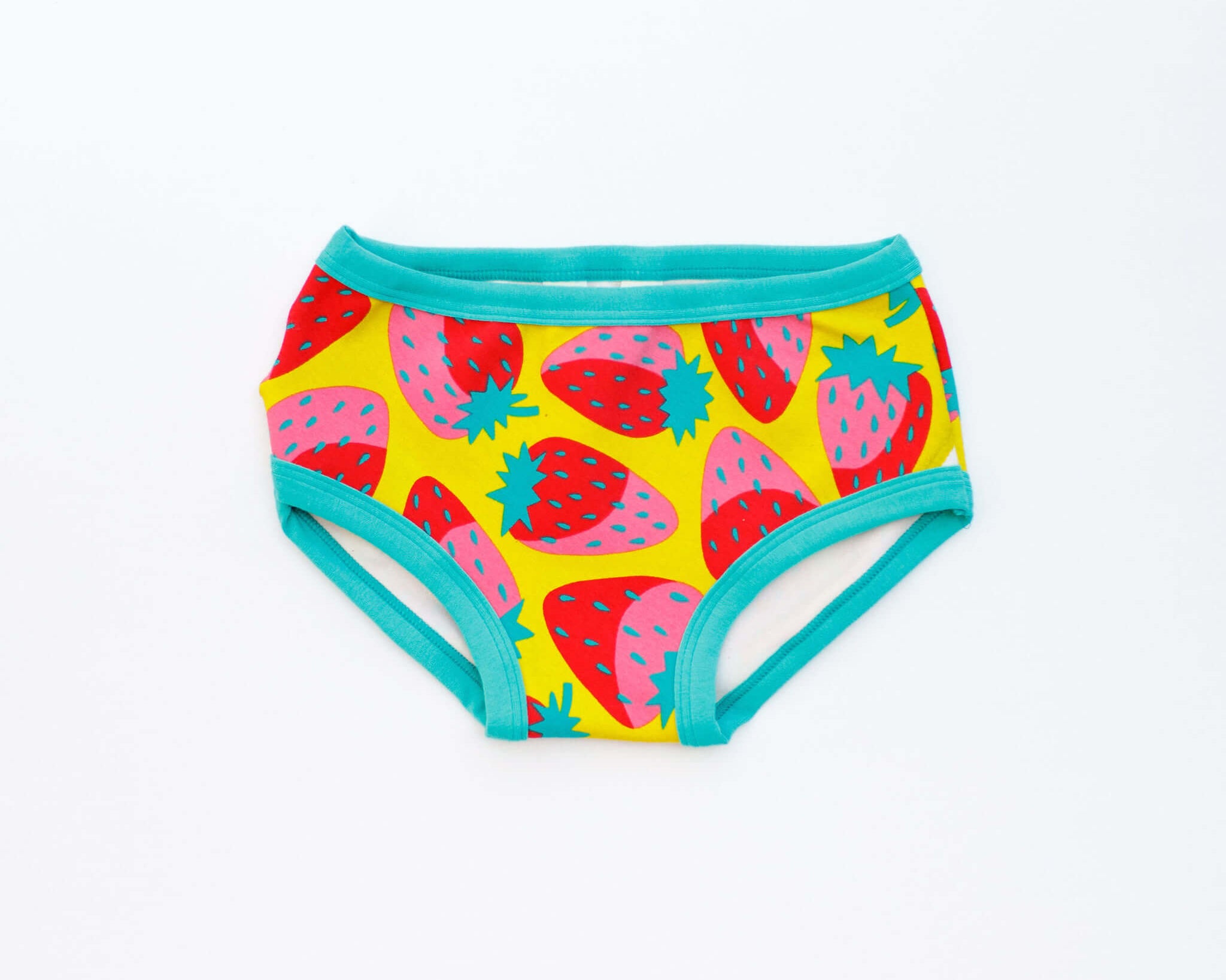 Flat lay of Thunderpants Kid's style underwear in Strictly Strawberry - pink, red, and green strawberries.
