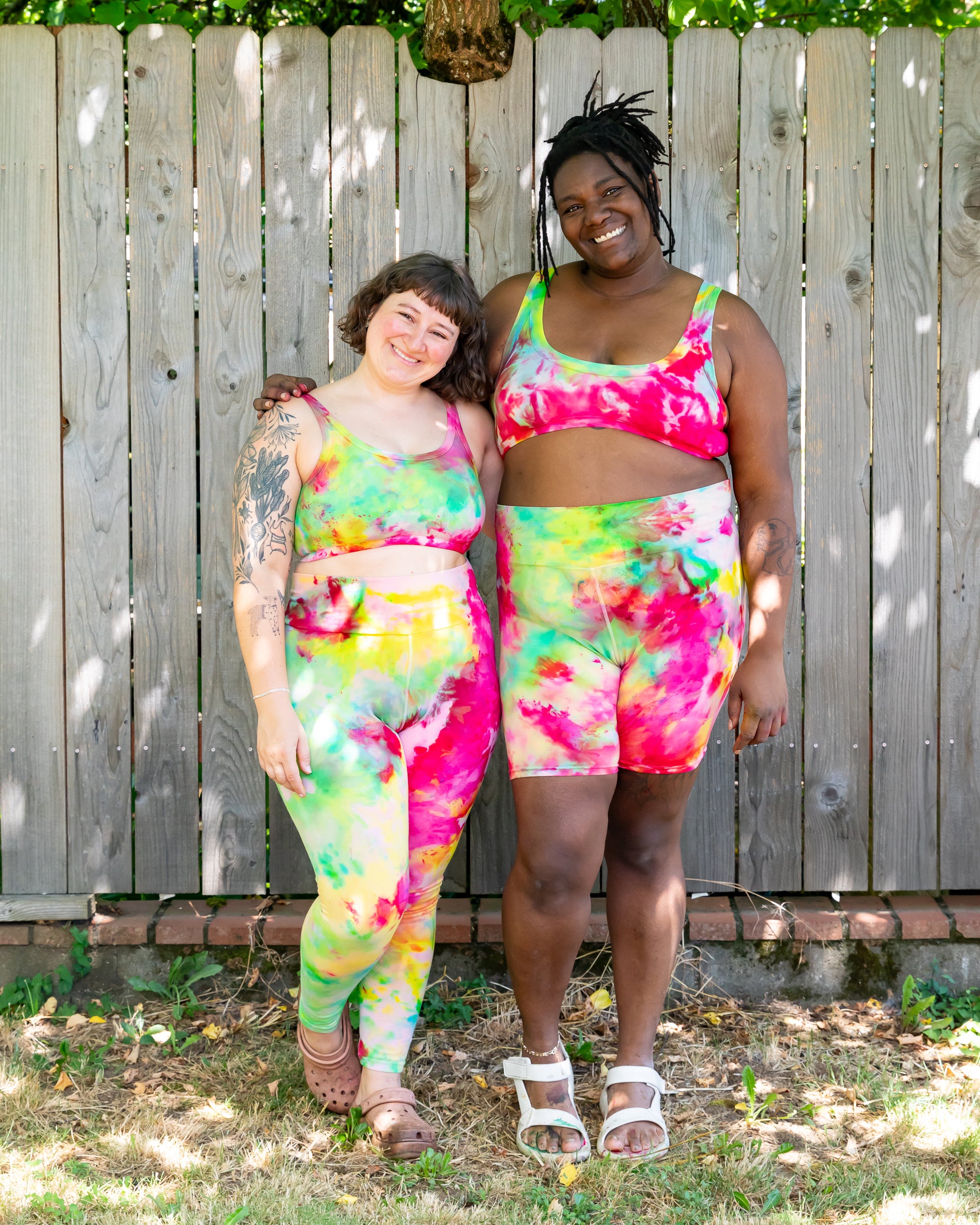 Models wearing various Thunderpants styles in Summer Crush Ice Dye - pinks, blues, yellows.
