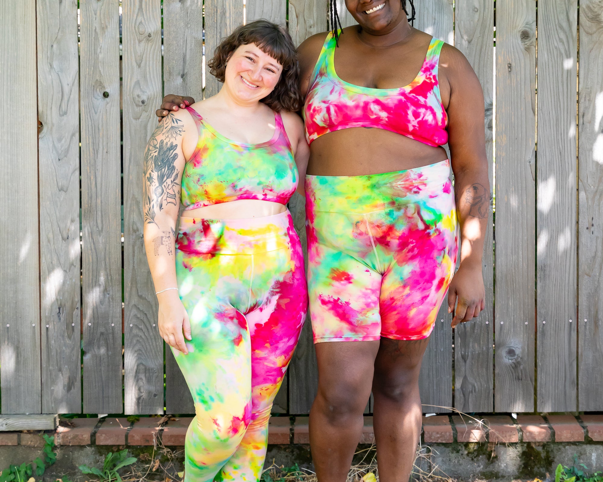 Models wearing various Thunderpants styles in Summer Crush Ice Dye - pinks, blues, yellows.