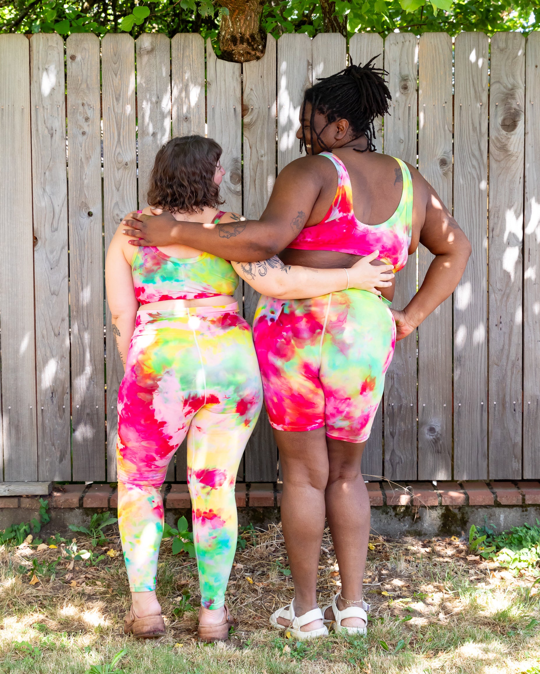 Models wearing various Thunderpants styles in Summer Crush Ice Dye - pinks, blues, yellows.