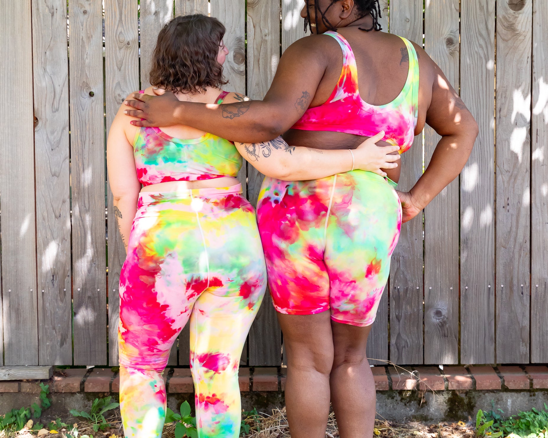 Models wearing various Thunderpants styles in Summer Crush Ice Dye - pinks, blues, yellows.