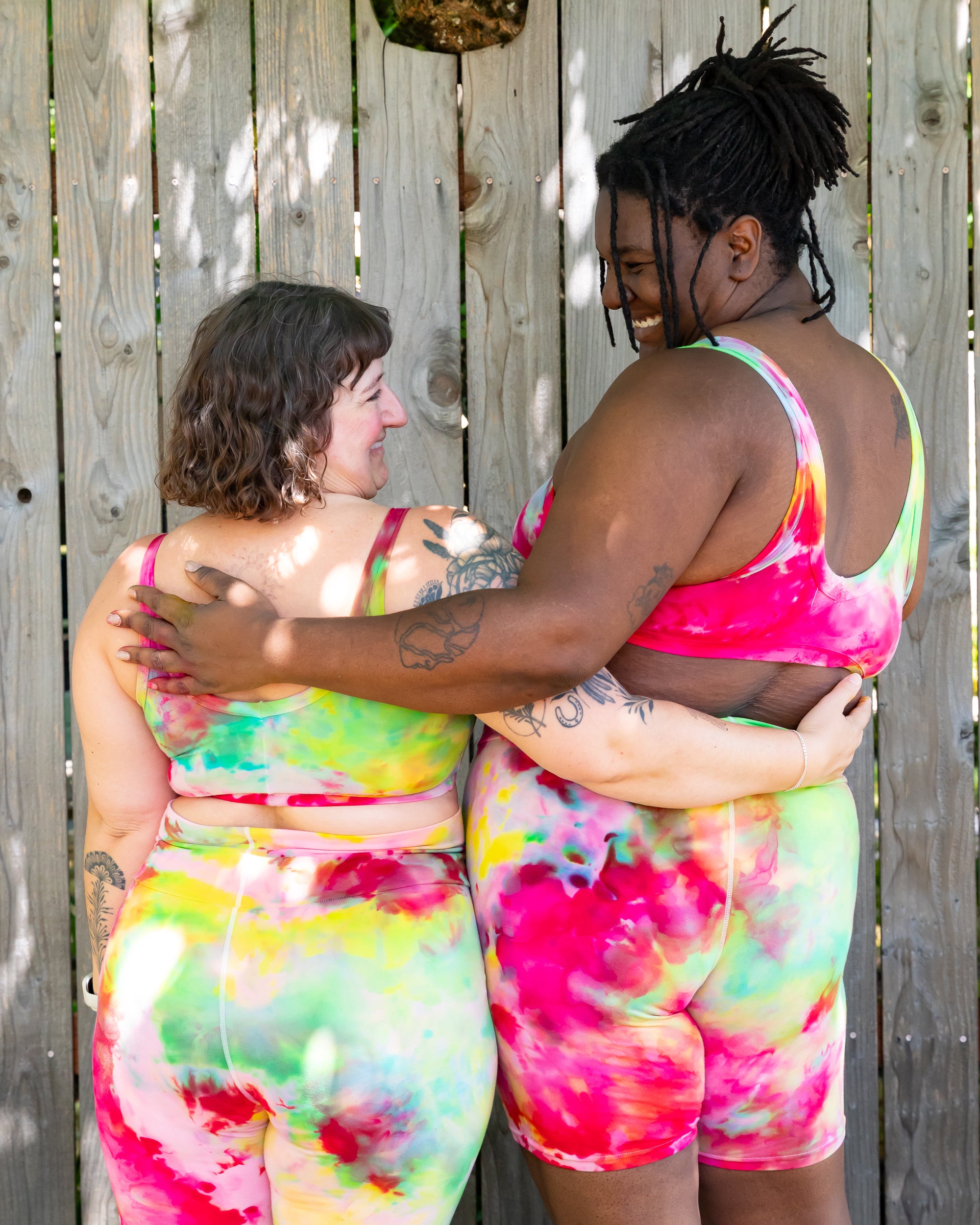 Models wearing various Thunderpants styles in Summer Crush Ice Dye - pinks, blues, yellows.