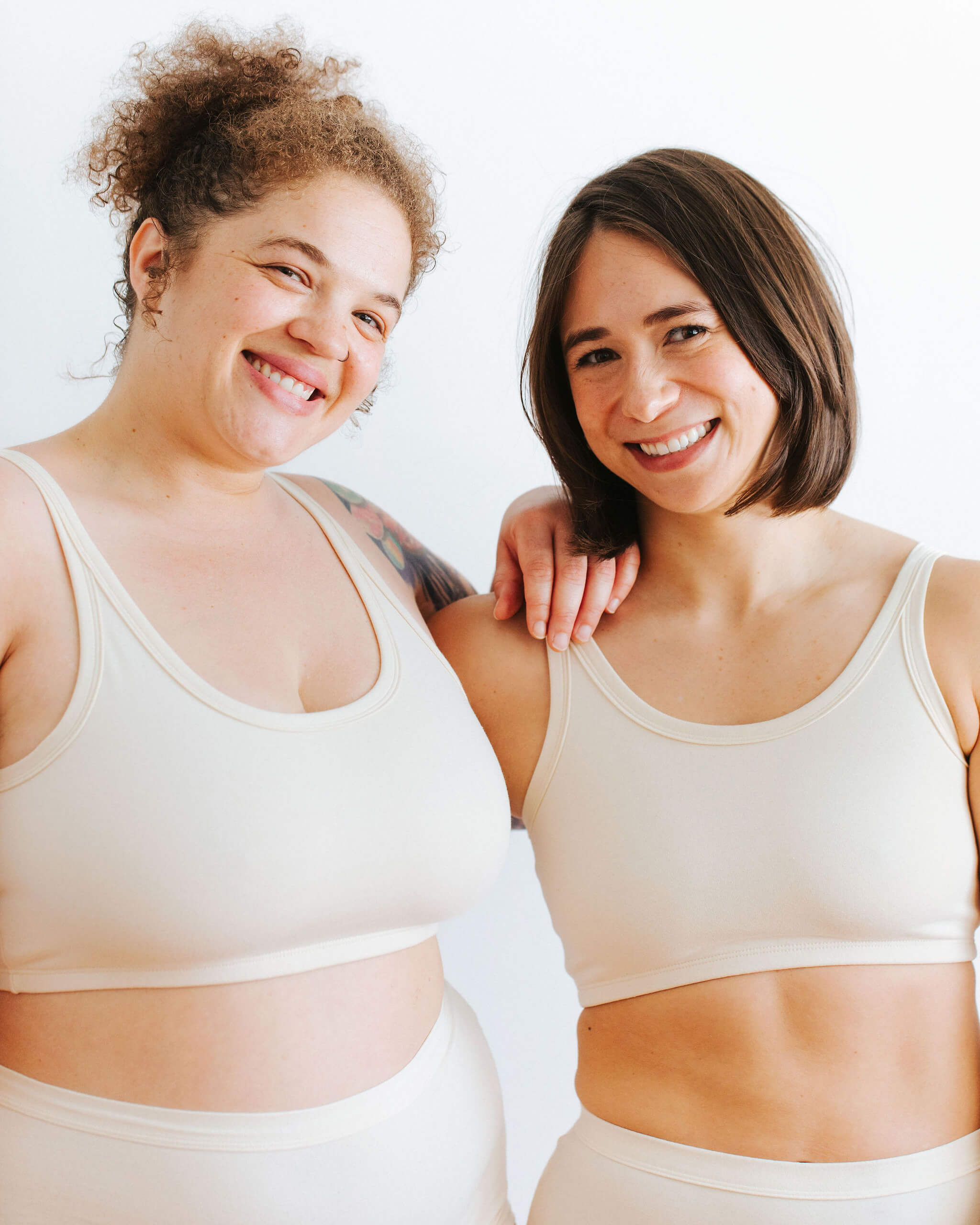 Fit photo from the back of Thunderpants organic cotton Longline Bra and Original style underwear on two models. 