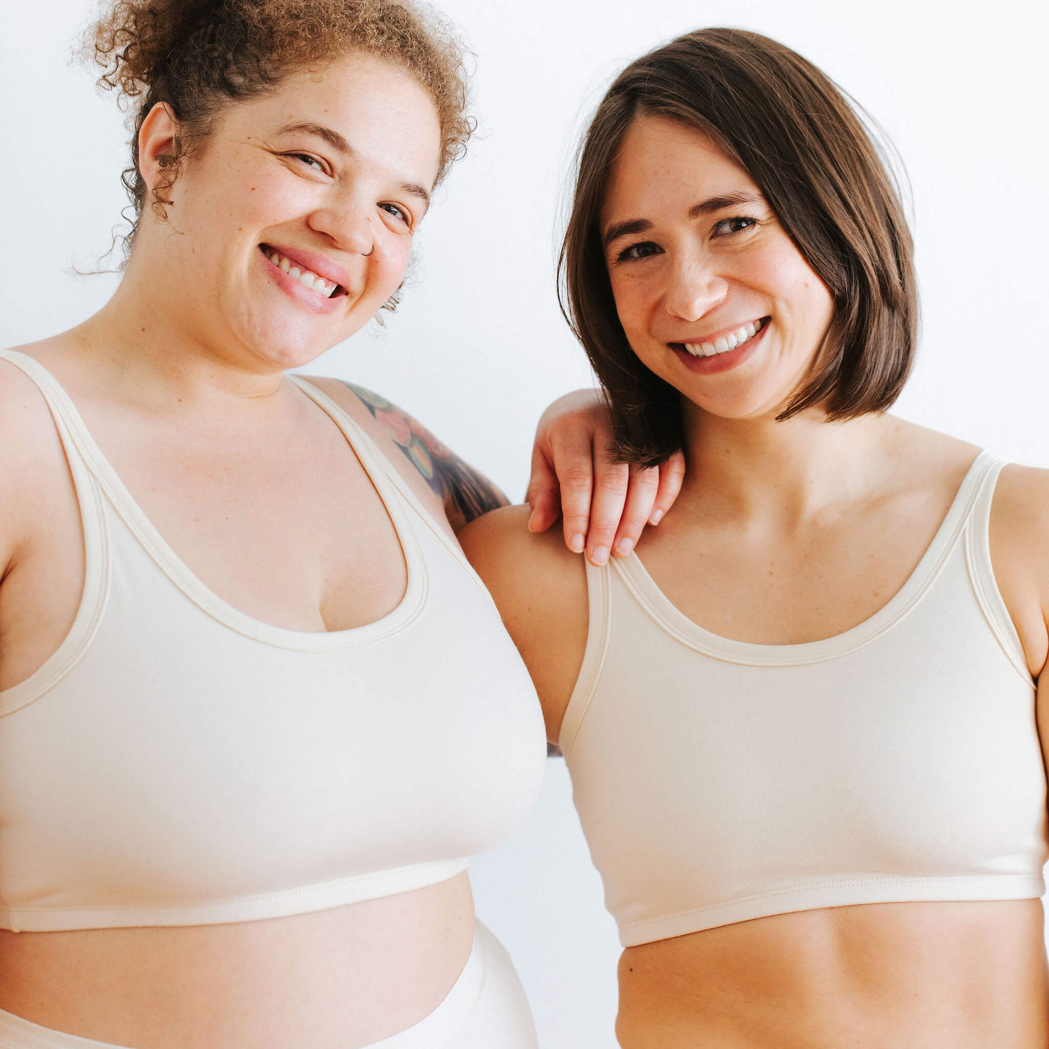 Fit photo from the back of Thunderpants organic cotton Longline Bra and Original style underwear on two models. 