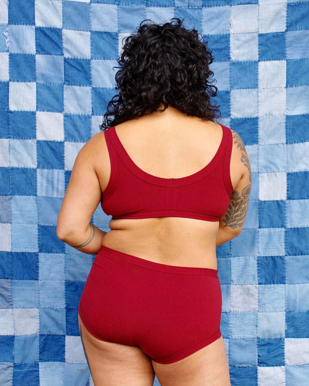 Model wearing Thunderpants Original style underwear and Bralette in Cabern-YAY - a deep wine red color.
