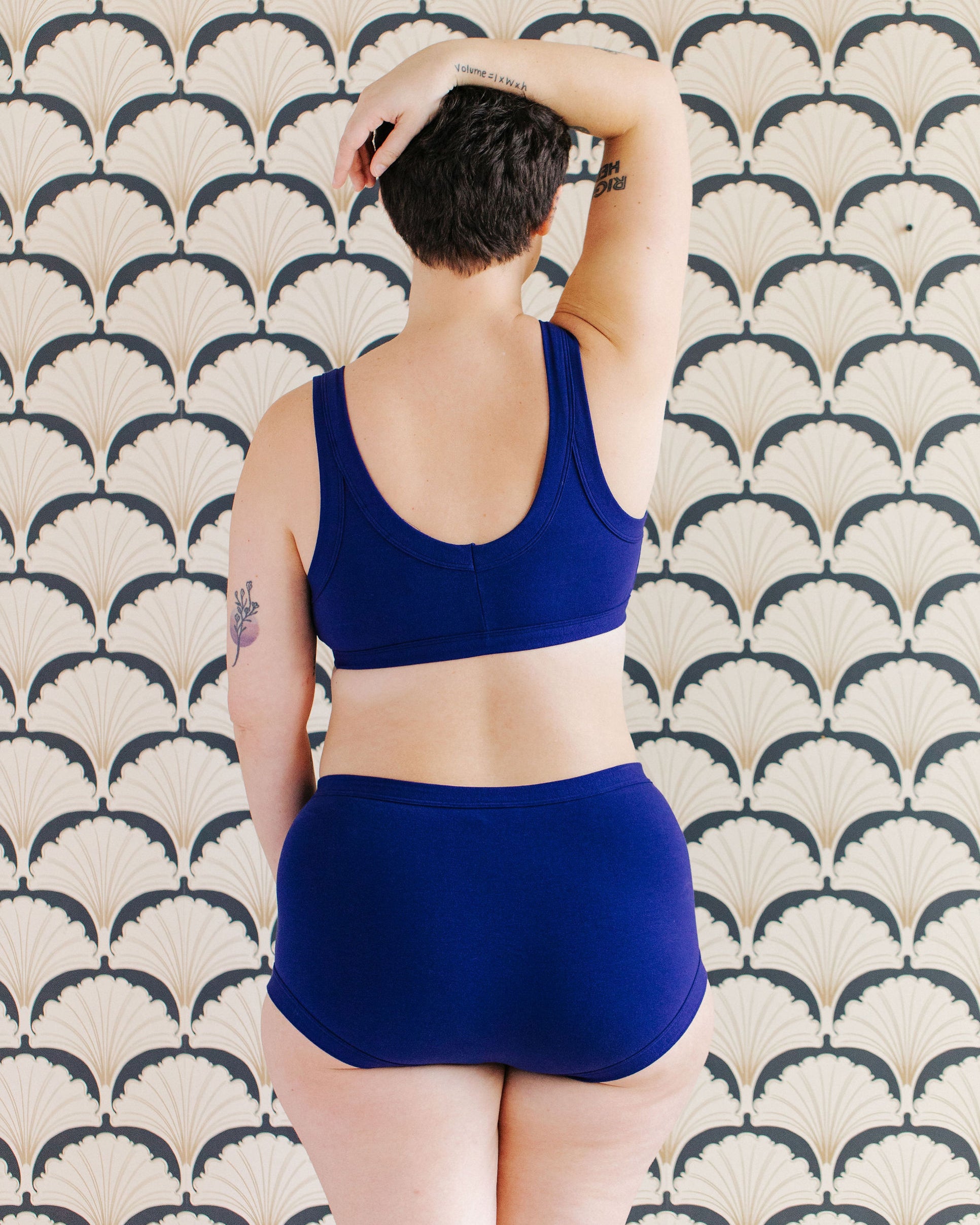 Model wearing Thunderpants Original style underwear and Bralette in Indigo blue.
