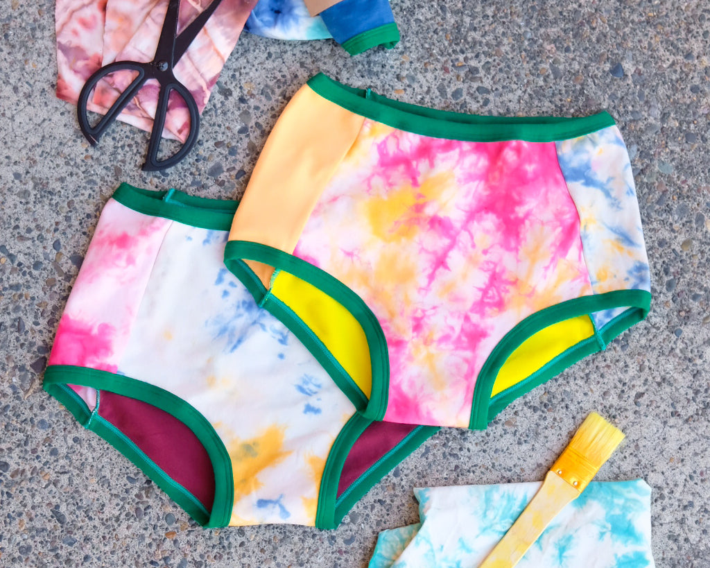 Flat lay of two Thunderpants Original style underwear in Dye Scrap Panel Pants - a mix of solids and dyed fabrics.