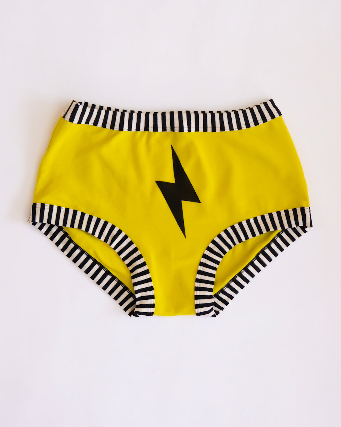 Flat lay of Thunderpants Original style underwear in Thunderstruck - yellow with a black lightning bolt.