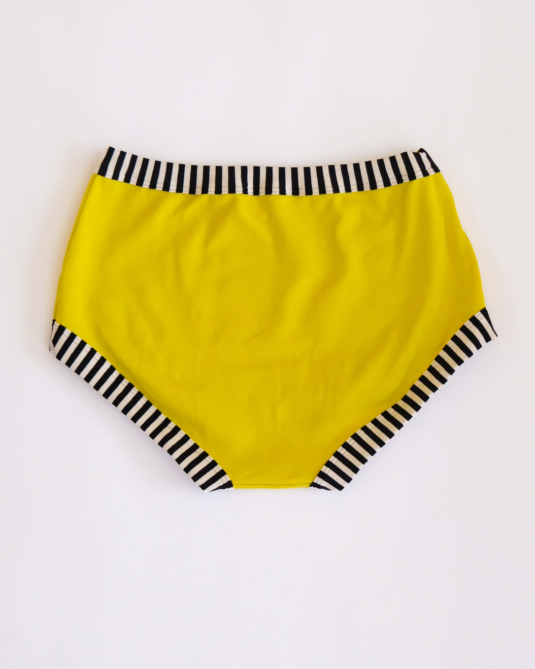 Flat lay of Thunderpants Original style underwear in Thunderstruck - yellow with a black lightning bolt.