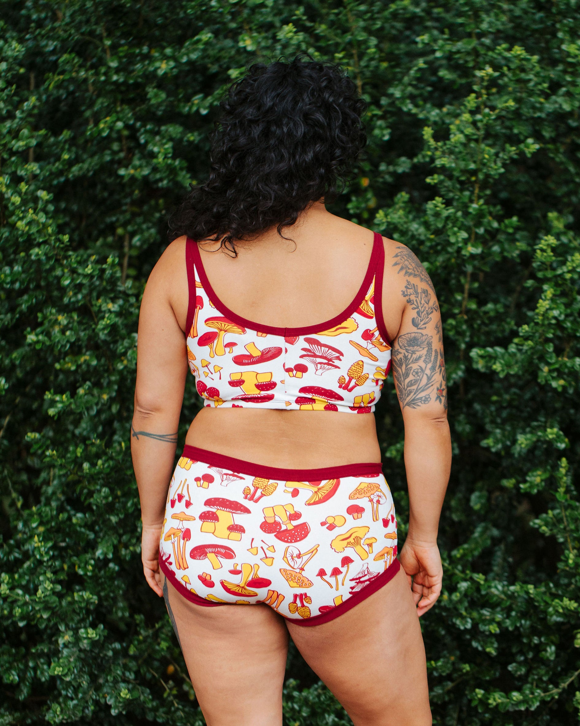Model wearing Thunderpants Original style underwear  and Longline Bra in Whadda Fungi - red, orange, and yellow mushroom print.