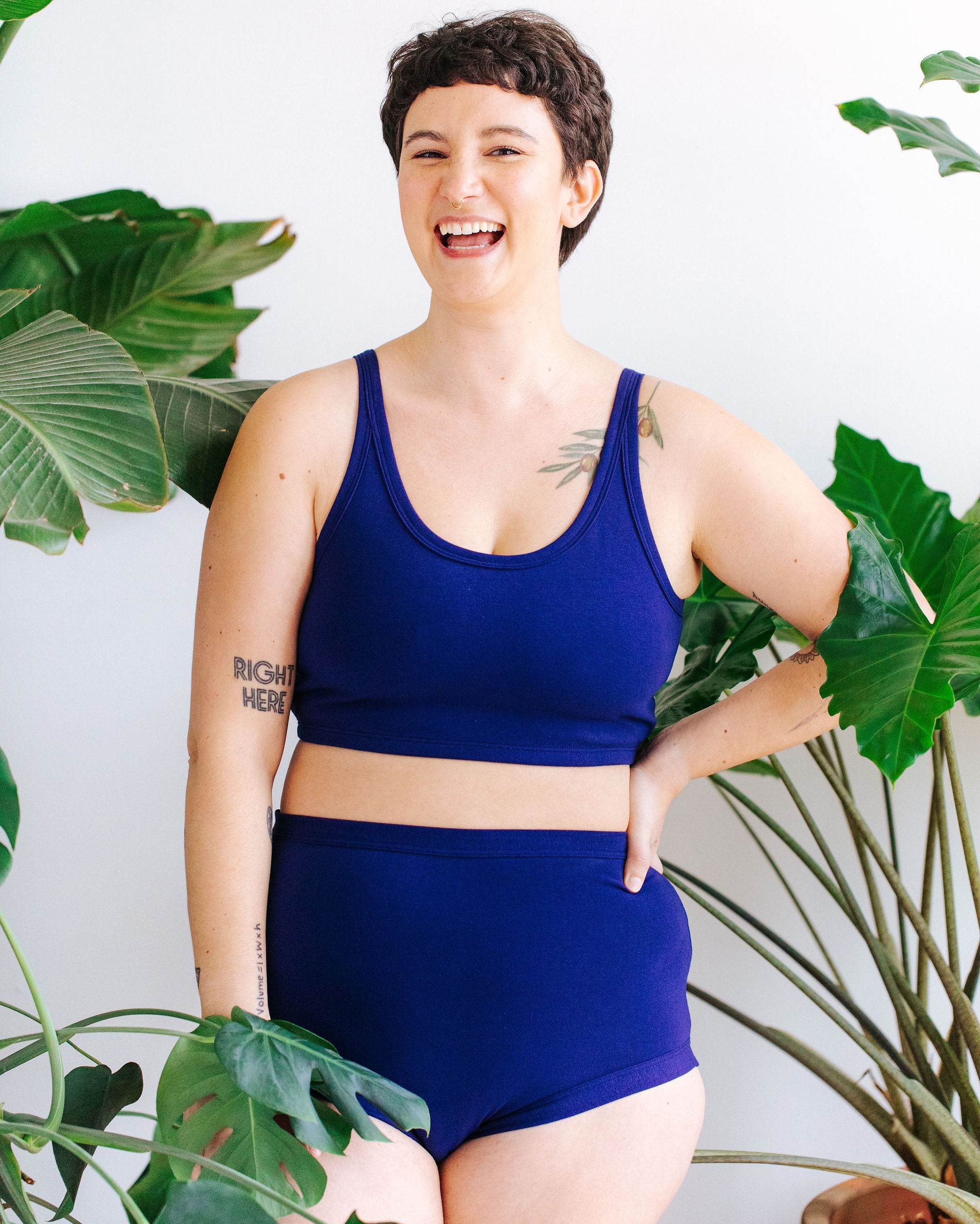 Model wearing Thunderpants Sky Rise style underwear and Longline Bra in Indigo blue.