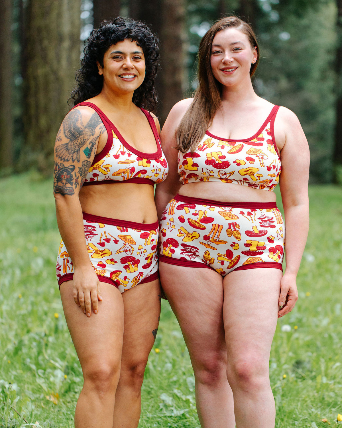 Two models wearing Thunderpants Sky Rise style underwear and Bralette in Whadda Fungi print - red, yellow, and orange mushroom print.