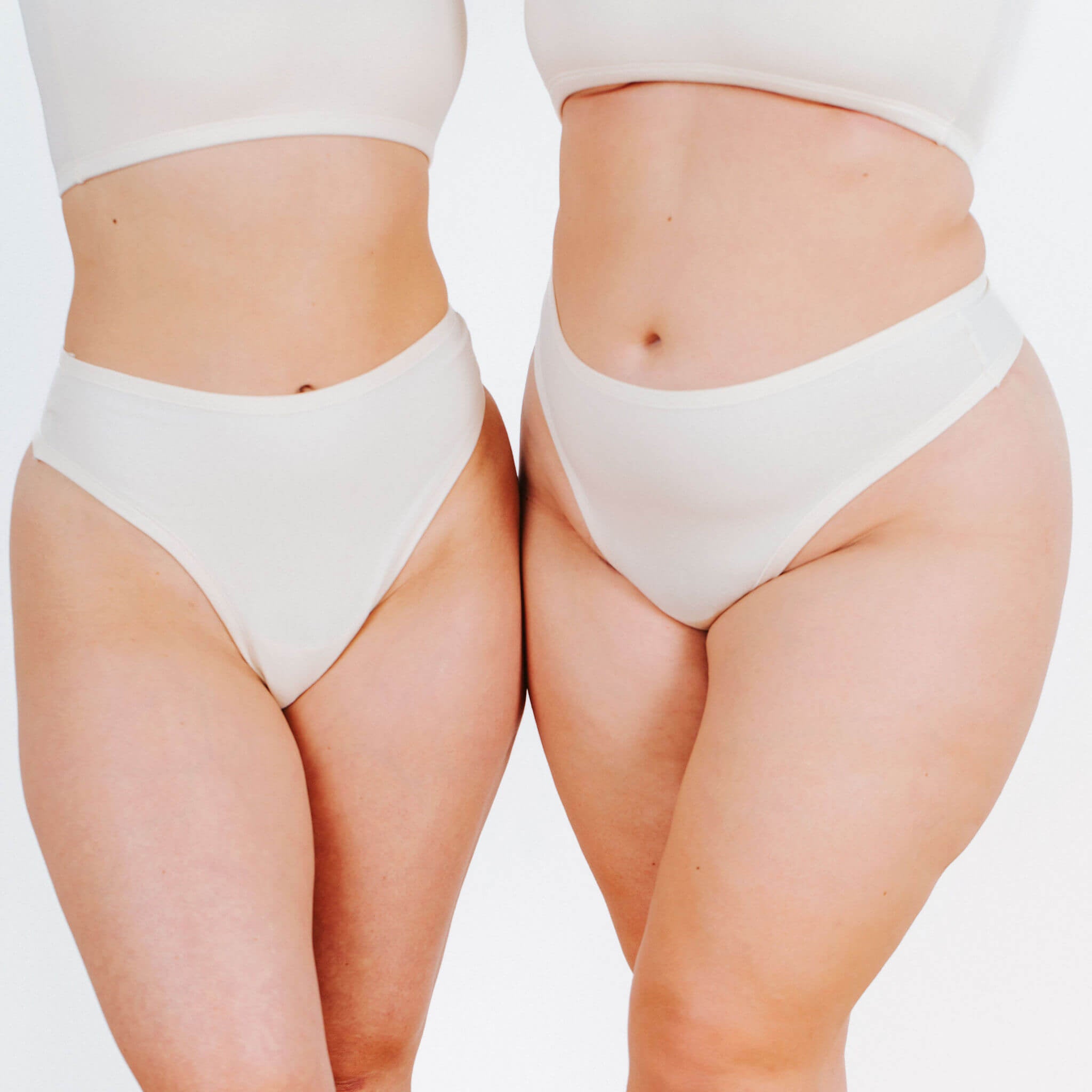 Fit photo of two models in Thunderpants organic cotton Thong style underwear in Plain Vanilla. 