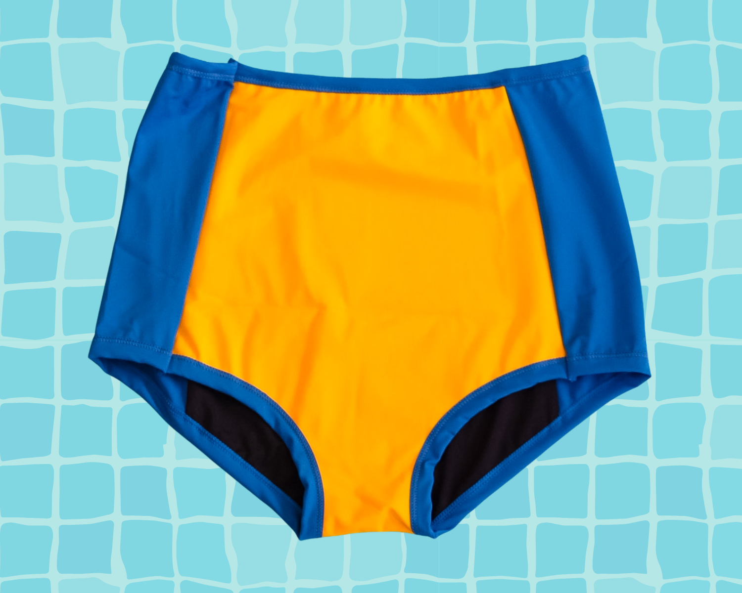Flay lay of Thunderpants US yellow and blue paneled Sky Rise style Swimwear Bottom.