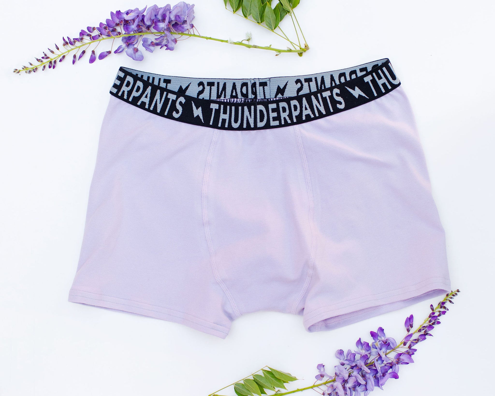 Flat lay of Thunderpants Boxer Brief style underwear in Wisterial Girl - a purple/grey color.
