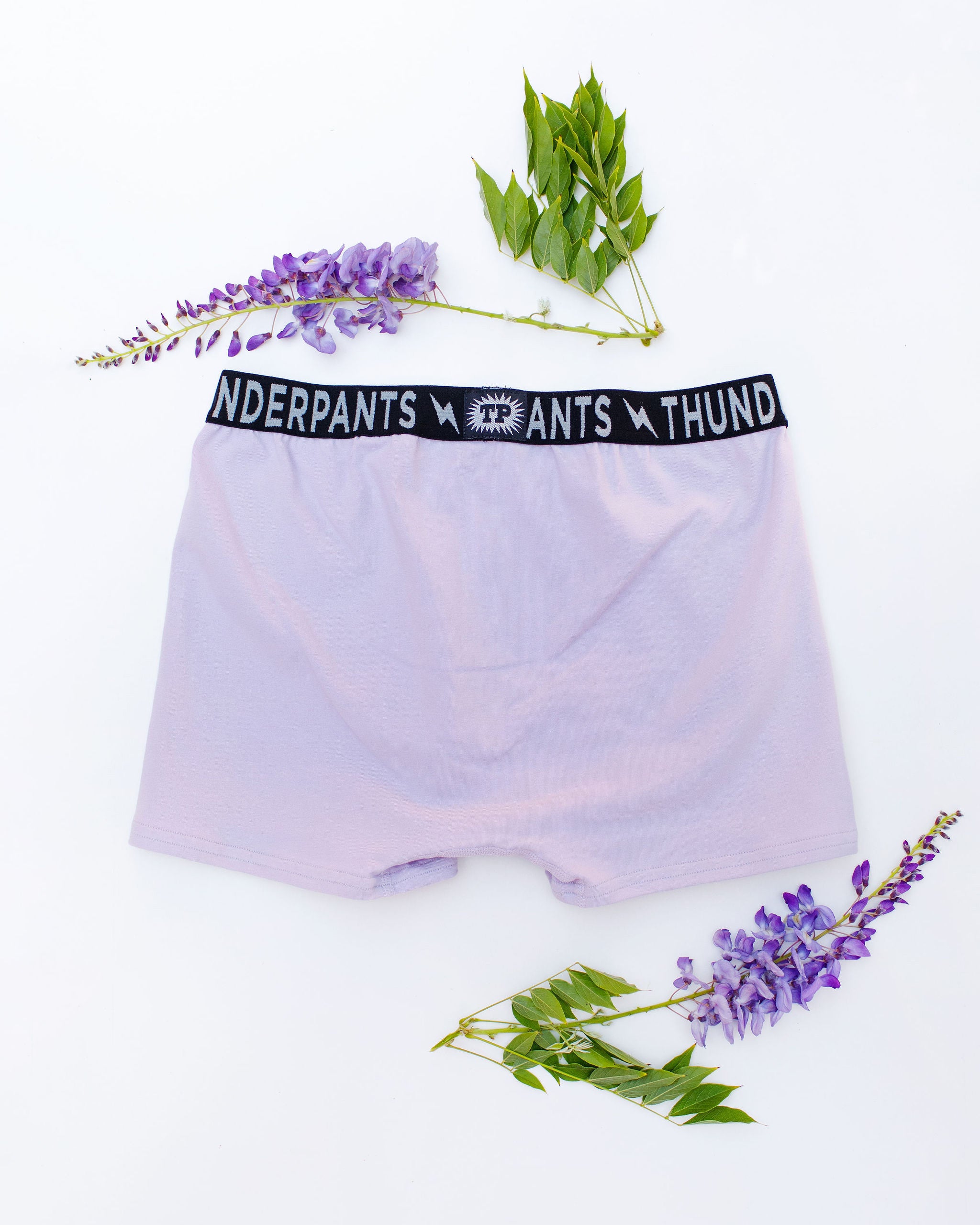 Flat lay of Thunderpants Boxer Brief style underwear in Wisterial Girl - a purple/grey color.