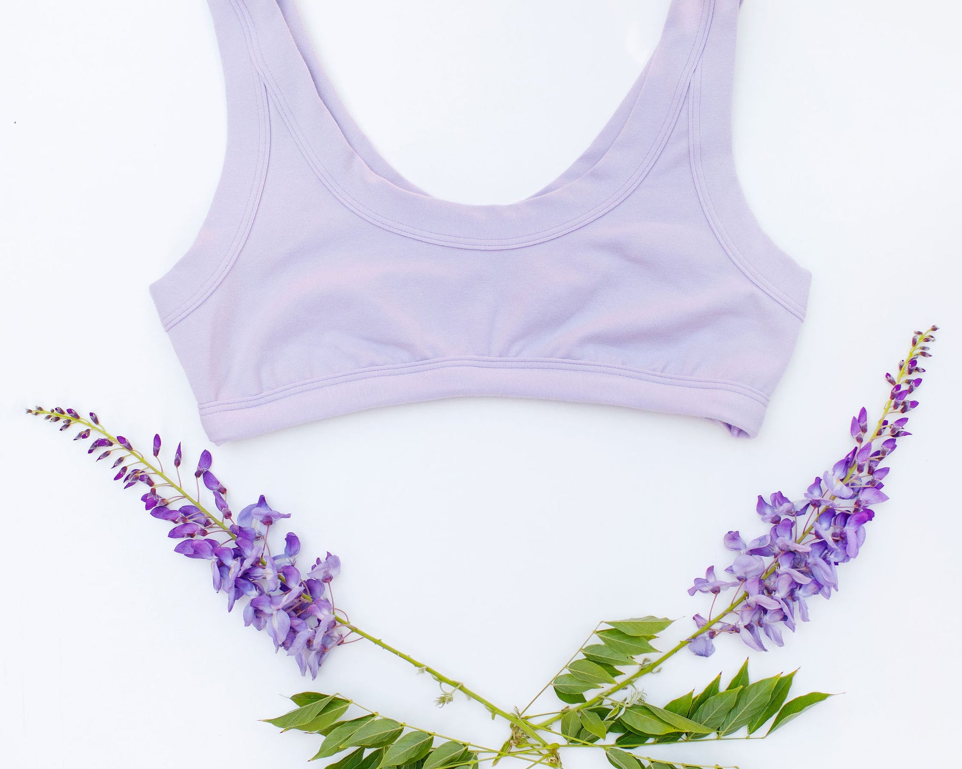 Flat lay of Thunderpants Bralette in Wisterial Girl - a purple/grey color.