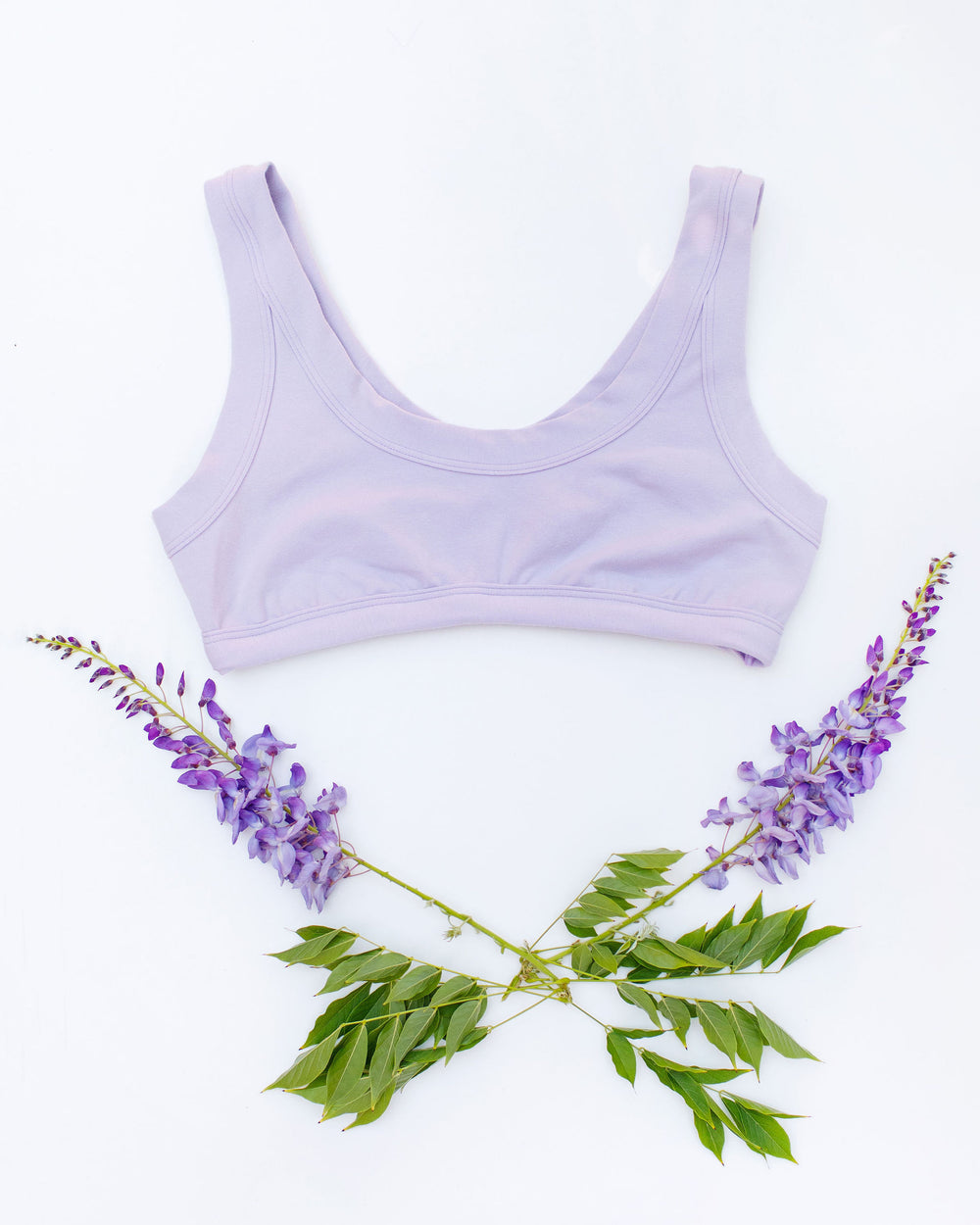 Flat lay of Thunderpants Bralette in Wisterial Girl - a purple/grey color.