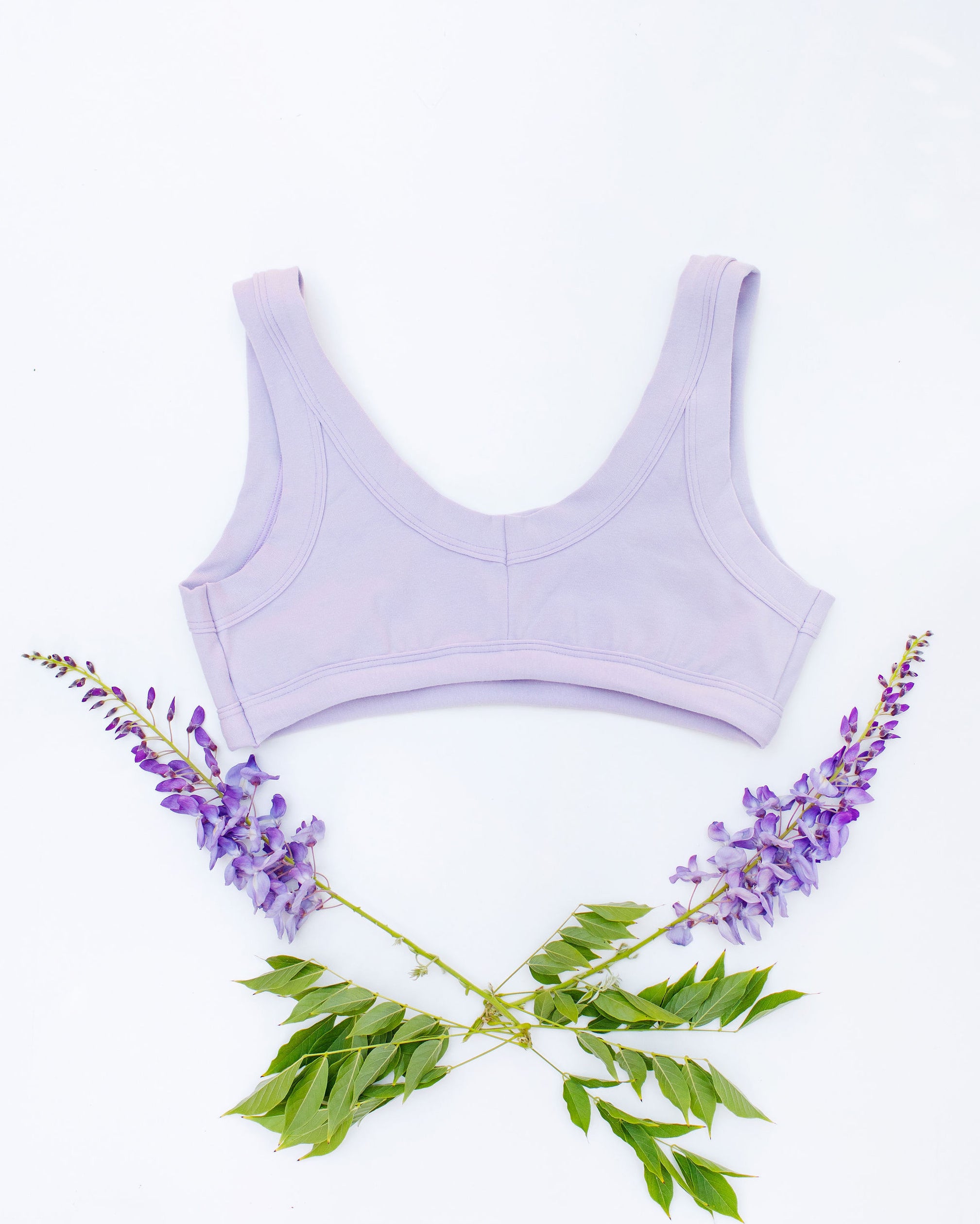 Flat lay of Thunderpants Bralette in Wisterial Girl - a purple/grey color.